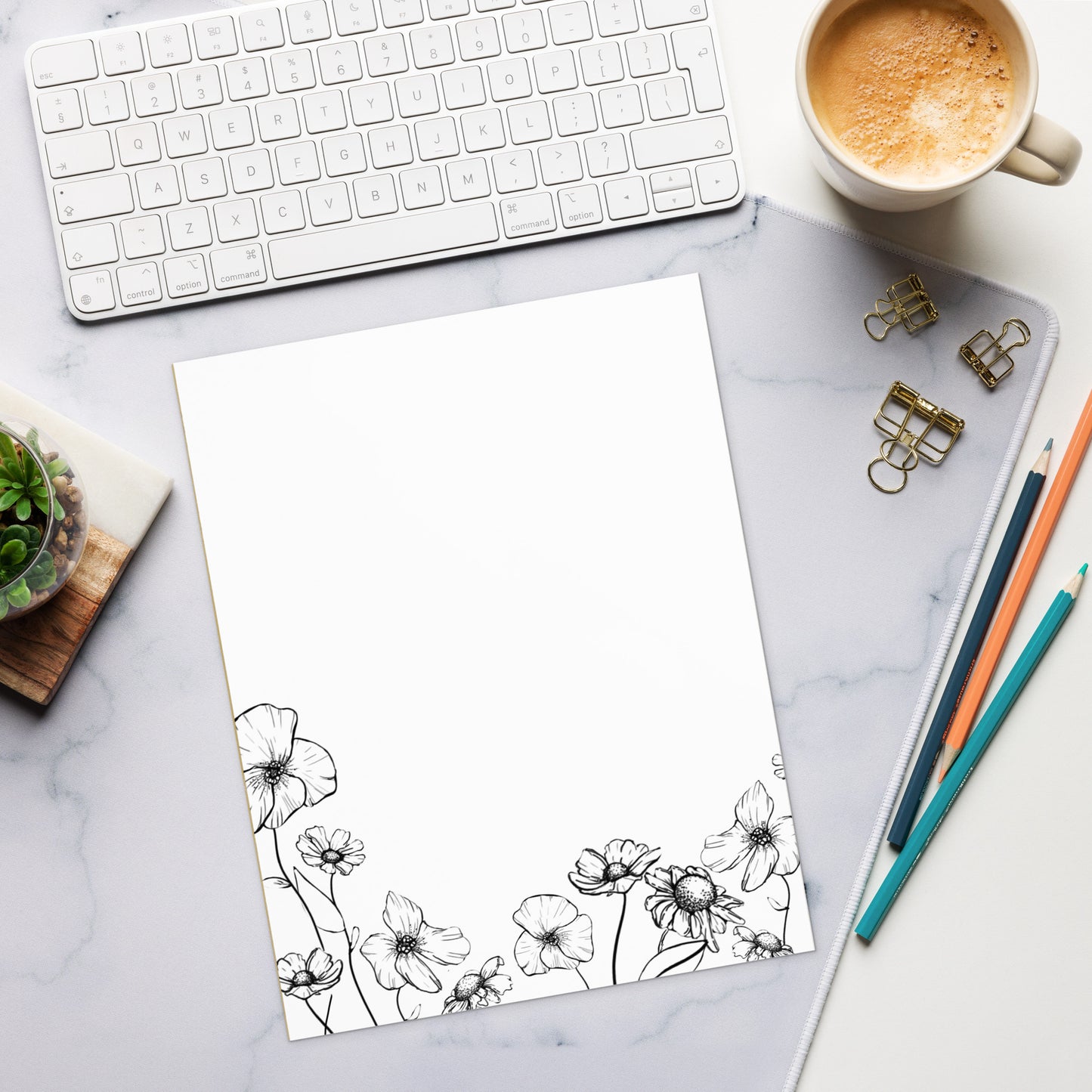 notepad with ink drawing of various spring flowers