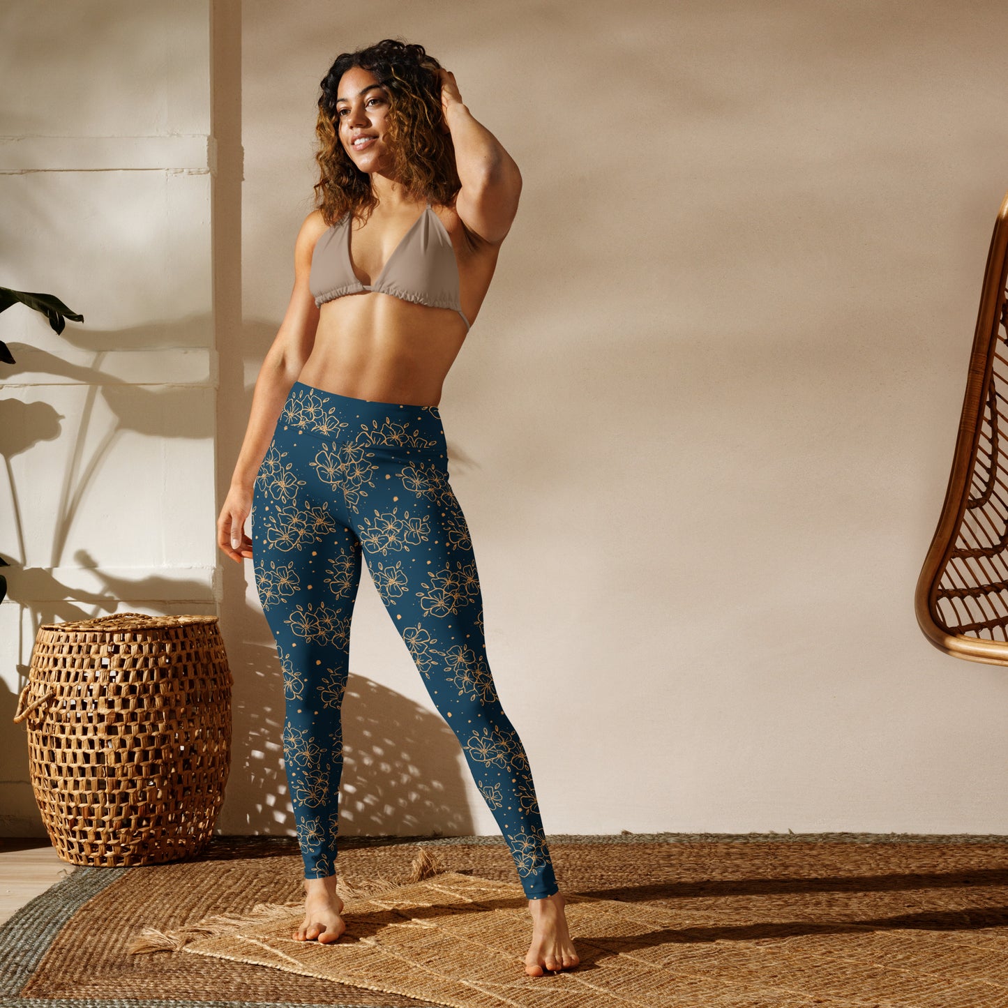 all over print yoga leggings, blue green with ochre blossom print, Clara design, model