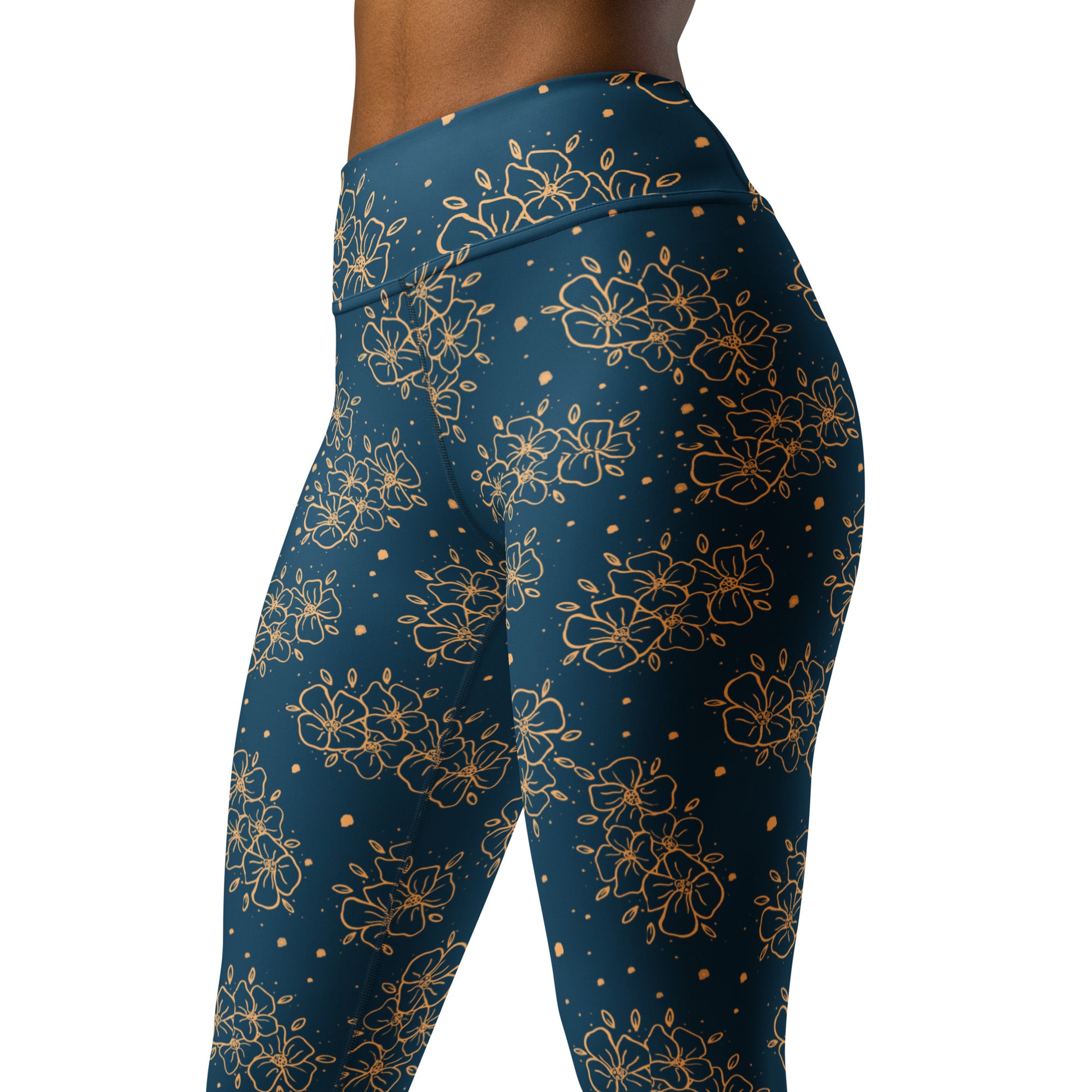 all over print yoga leggings, blue green with ochre blossom print, Clara design, model