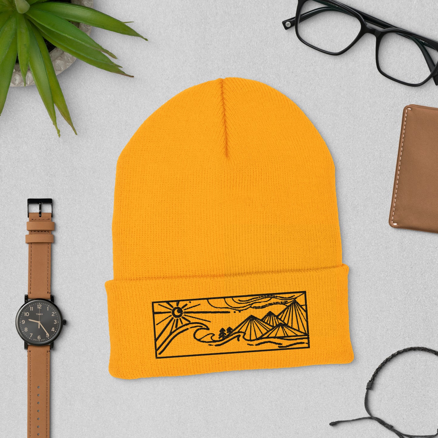 cuffed beanie, black embroidery of seascape and mountains, gold