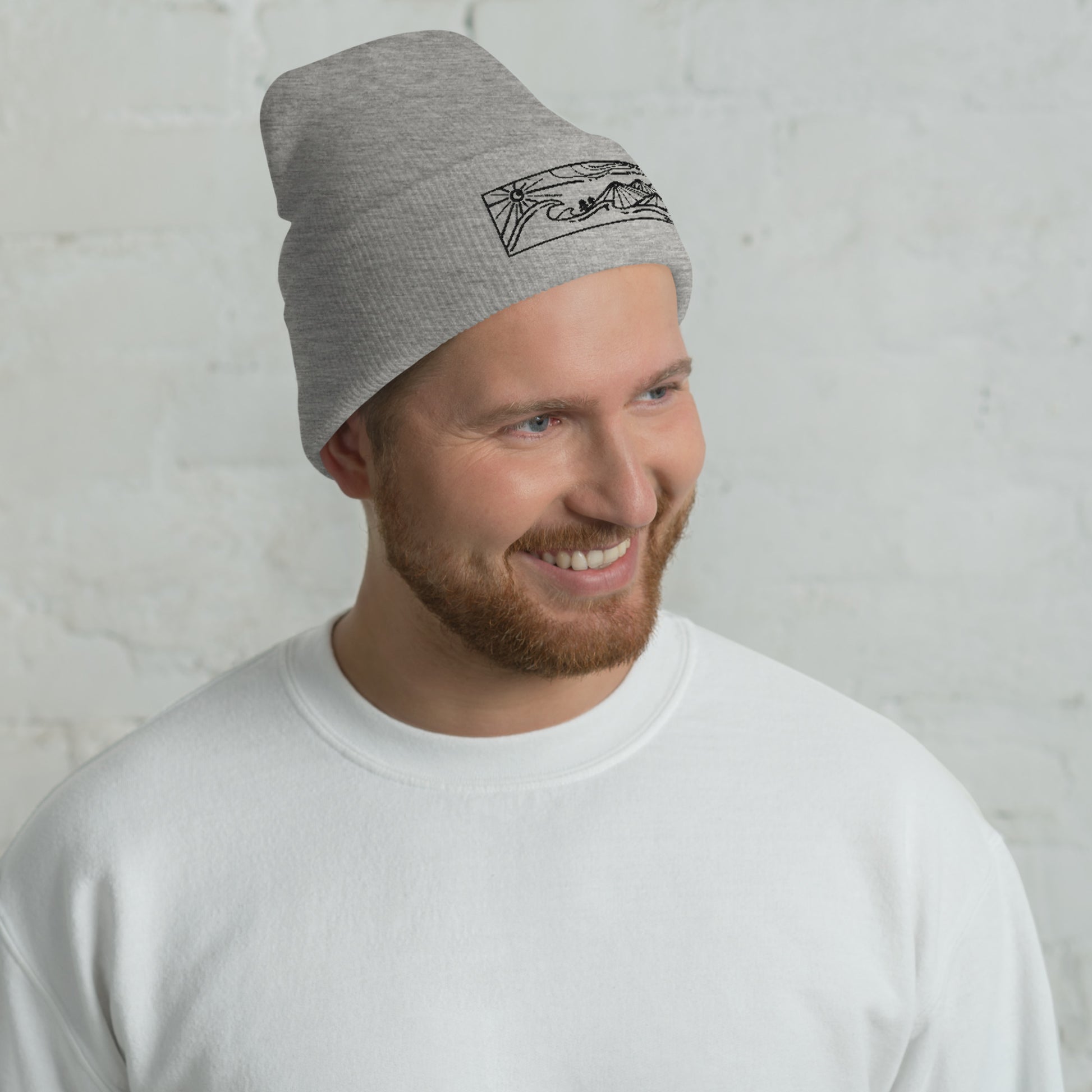 cuffed beanie, black embroidery of seascape and mountains, grey, model