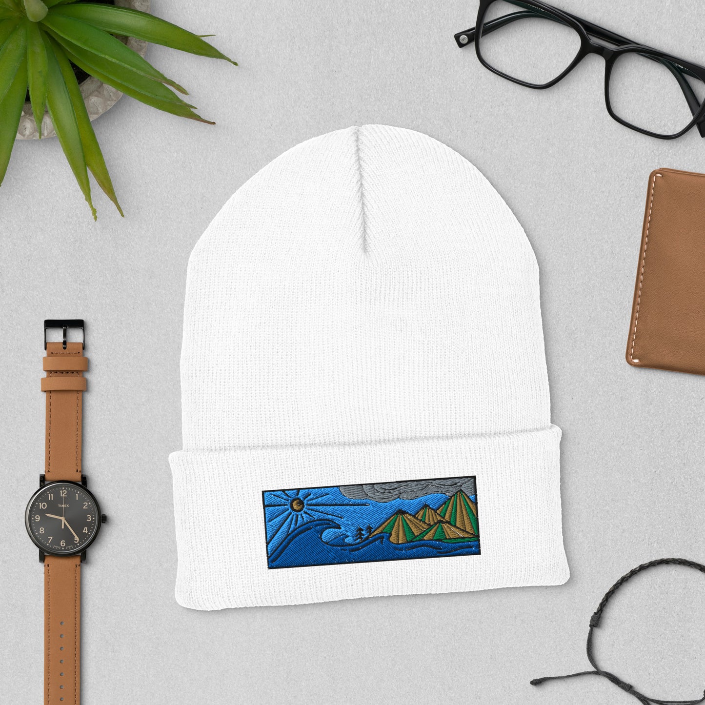 Product mockupcuffed beanie, colored embroidery of seascape and mountains, white