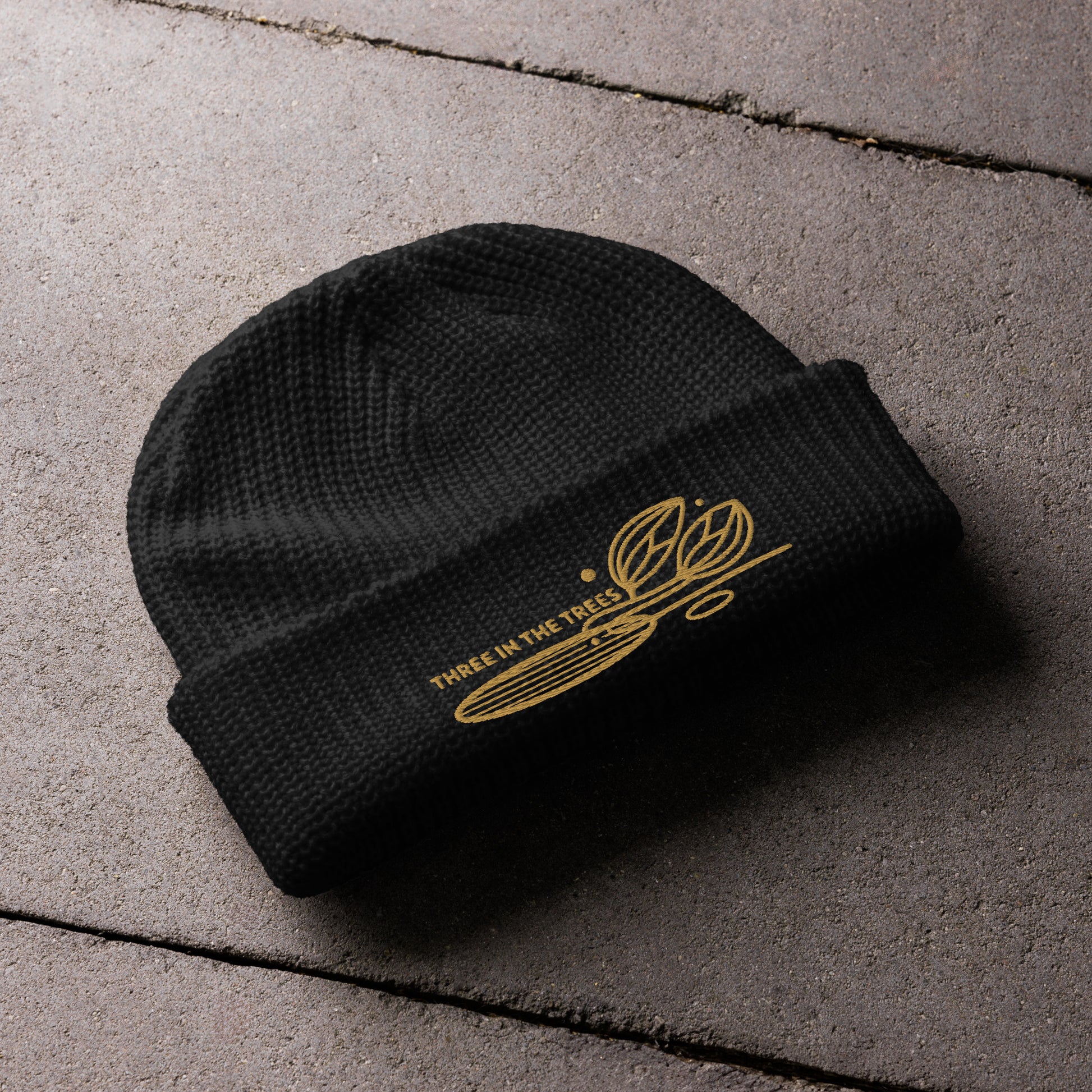 fisherman beanie, black, Three in the Trees laid out design embroidered