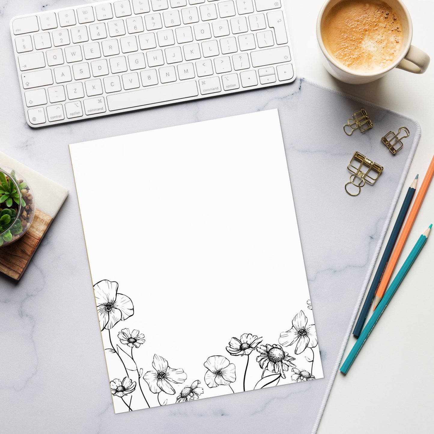 notepad with ink drawing of various spring flowers 